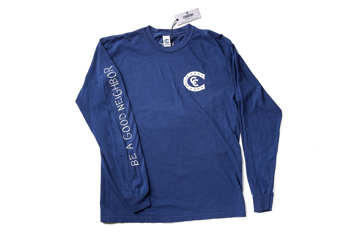 Country Cannabis Navy Long Sleeve with white print. White print is Country Cannabis pocket print and Matt McCormick&#39;s signature font on the sleeve reminding us to be a good neighbor